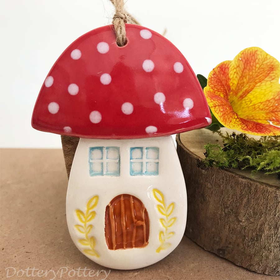 Ceramic toadstool decoration with yellow leaves
