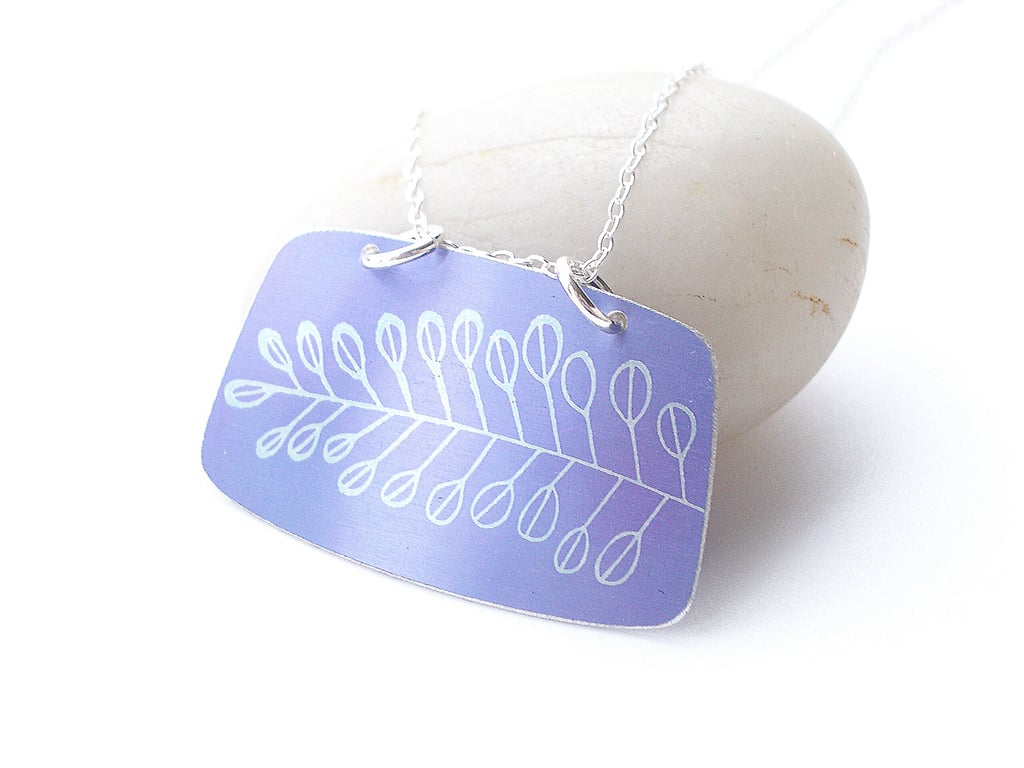 Purple rectangular pendant with tree print