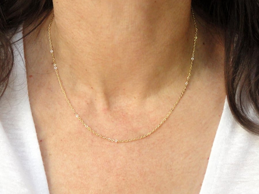 Thin gold necklace with on sale pendant