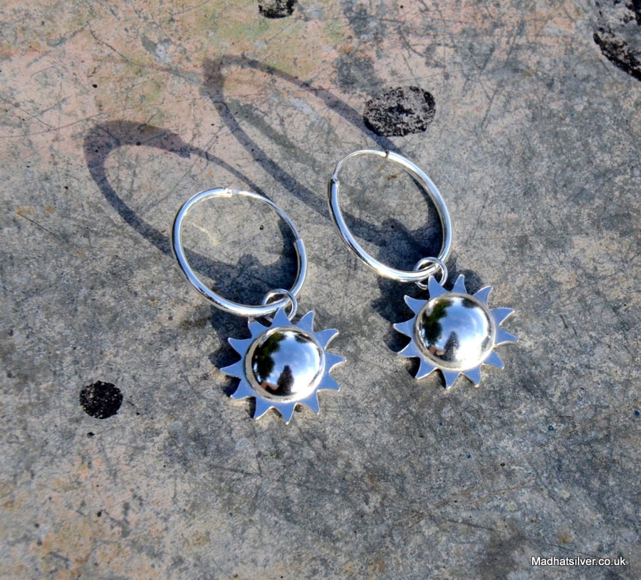 Silver sun hoop earrings