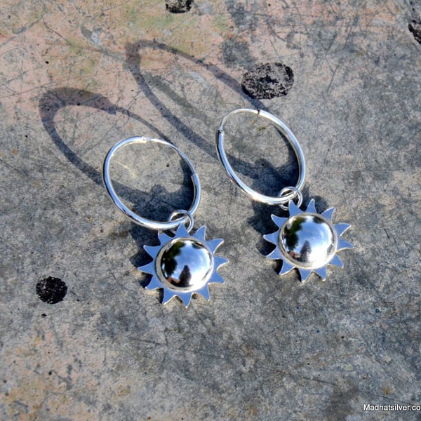 Silver sun hoop earrings