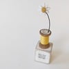 Clay Daisy on a Teeny Vintage Bobbin 'it's the little things'