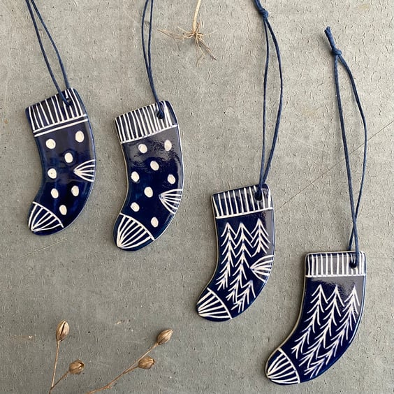 Set of four ceramic sock decorations .