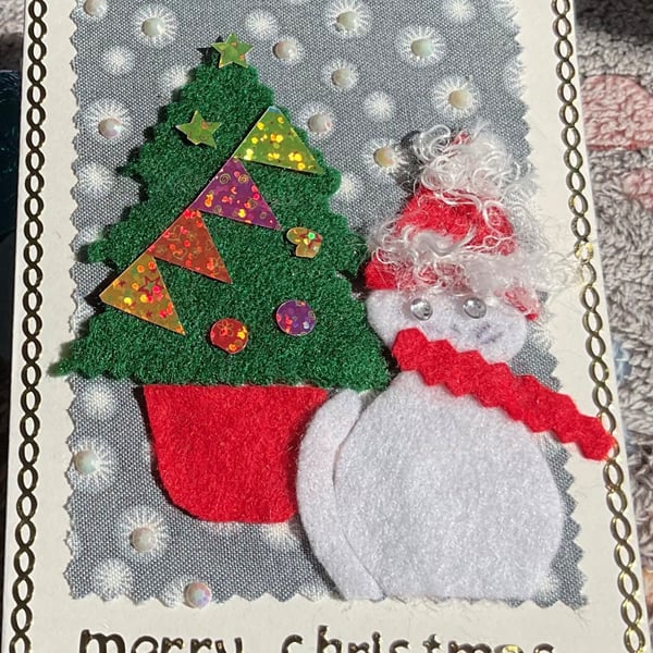 Cute Christmas card. Hope the cat  doesn't peep at the presents 