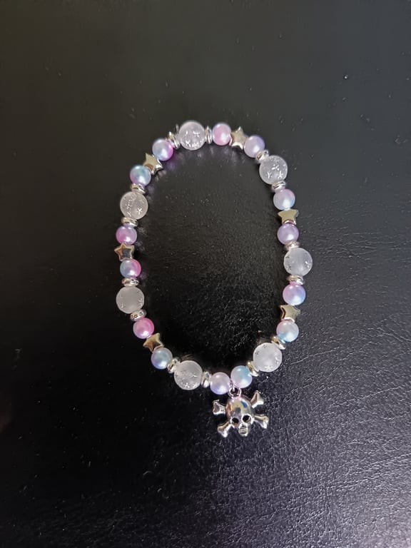Elasticated skull and crossbones charm bracelet with pastel beads