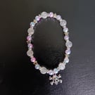 Elasticated skull and crossbones charm bracelet with pastel beads