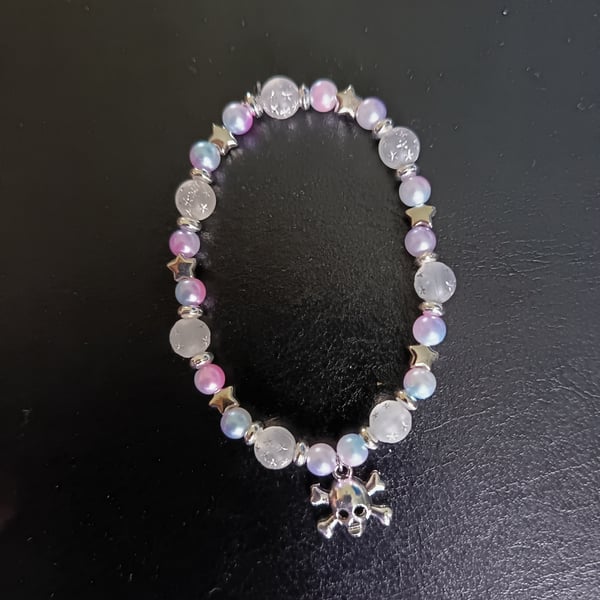 Elasticated skull and crossbones charm bracelet with pastel beads