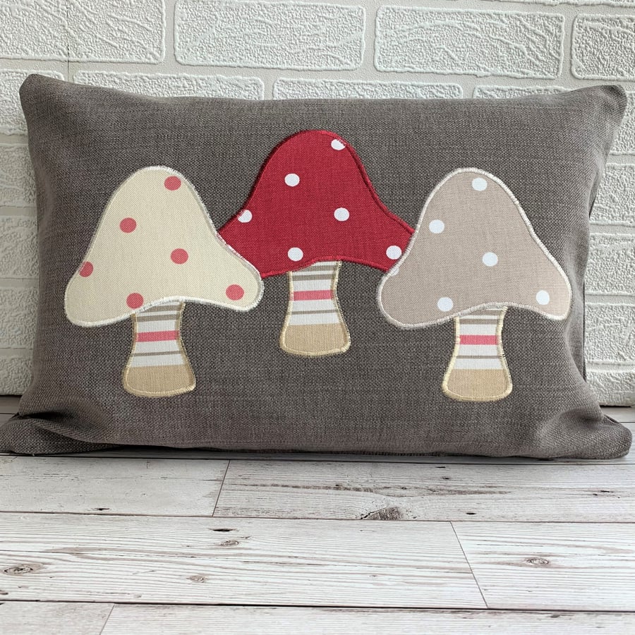 SOLD - Toadstools cushion with three spotty toadstools