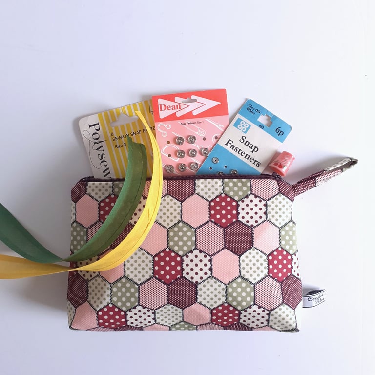 Make up or toiletries bag in a vintage patchwork print design.