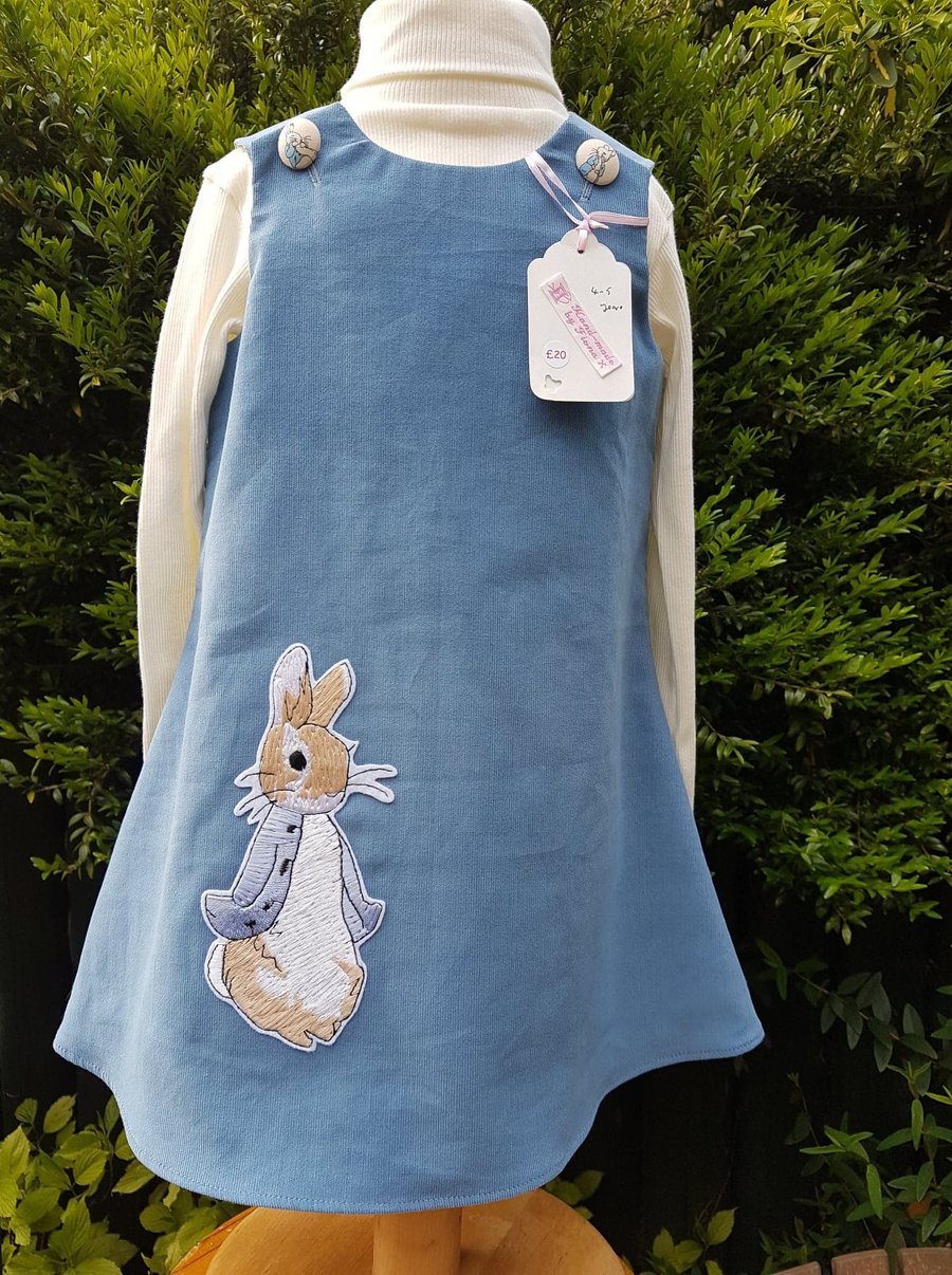 Pale blue baby needlecord pinafore dress. Age: 4-5 years. Free postage to UK