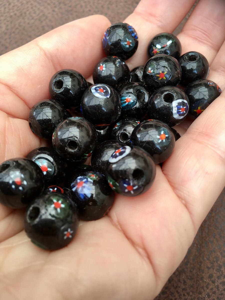 A set of 31 Vintage Black Millefiori Glass Beads from a Vintage Necklace.