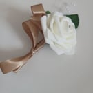 White foam rose buttonholes with gold ribbon details