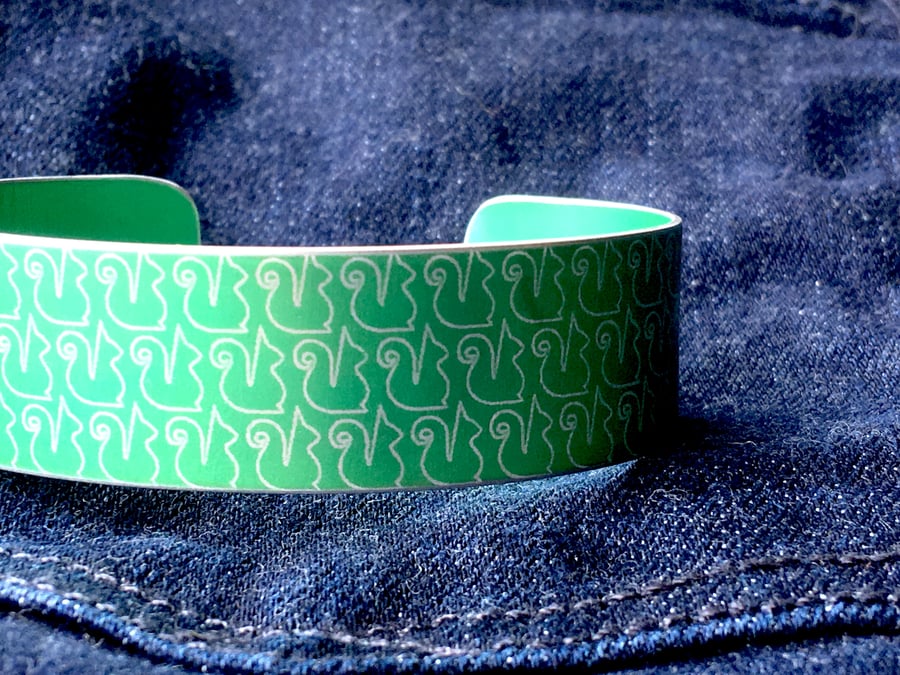 Anodised aluminium squirrel print cuff bronze