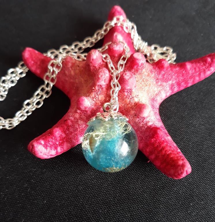 R1. Resin seaside globe necklace