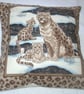 Beautiful Snow Leopard sitting with her two cubs cushion