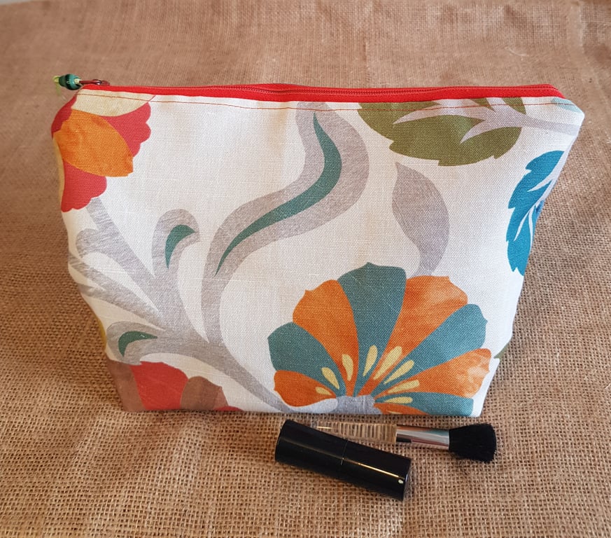 Zipped pouch, large: large contemporary orange and teal floral design.