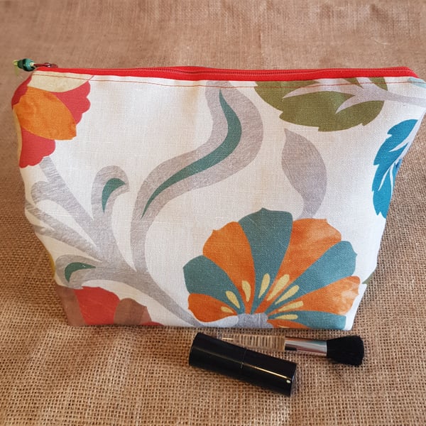 Zipped pouch, large: large contemporary orange and teal floral design.