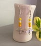 Yellow mix seed bead earrings, with silver-plated bee charm - Image 1