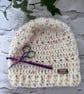 Glitter cream with rainbow speckles beanie
