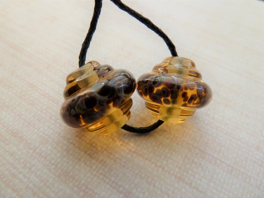 amber ornate lampwork glass bead pair