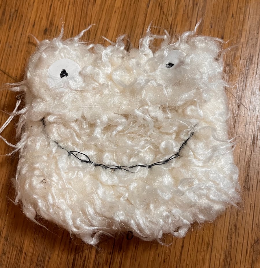 Cream monster face purse