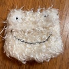 Cream monster face purse