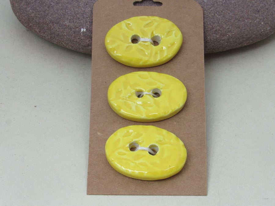 3 Medium Oval Lemon Yellow Sprig Pattern Ceramic Buttons