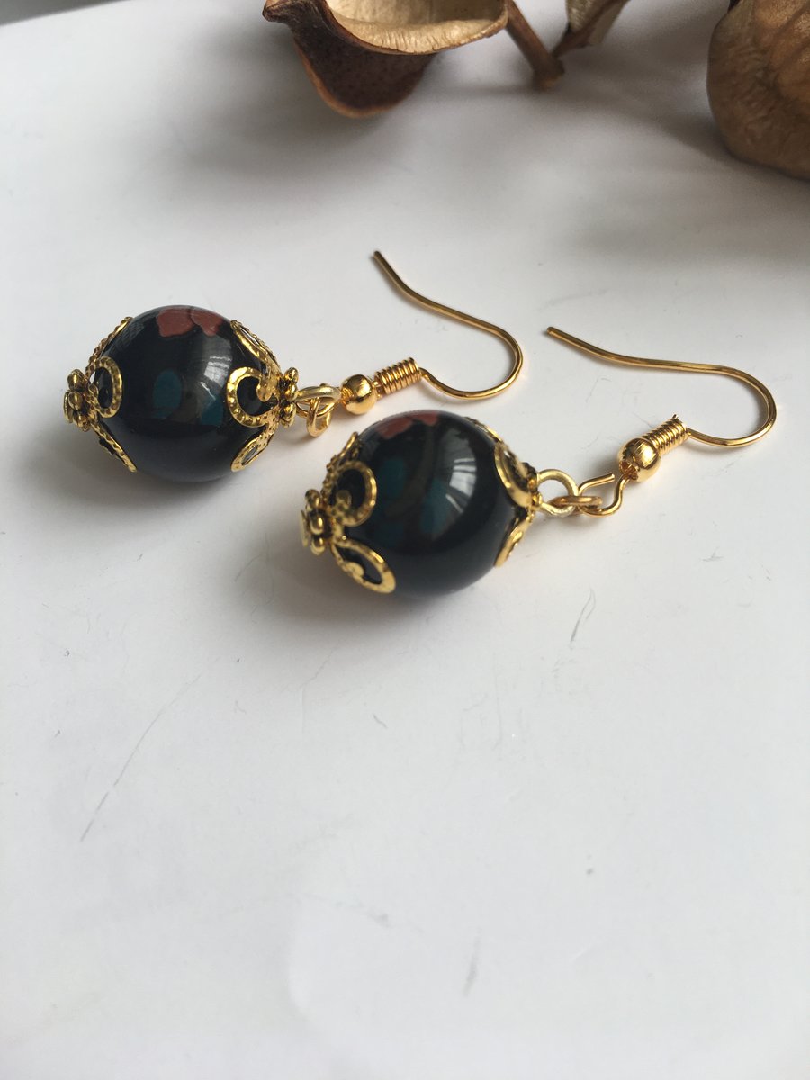 Black painted glass bead earrings with gold plated wires