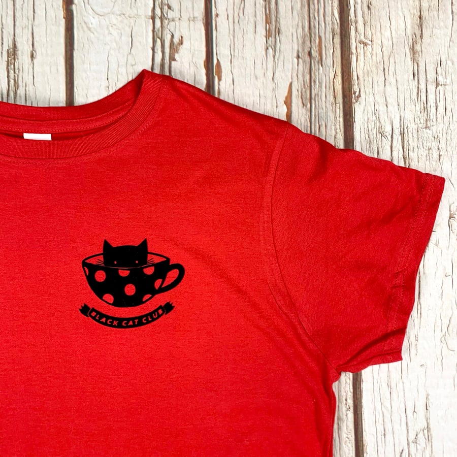 Black Cat Club Woman's red top with teacup and paw prints. Ladies T-Shirt.