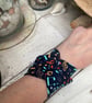 Wide cuff fabric bracelet in music theme