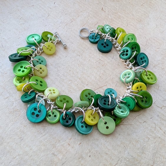 Green button bracelet with silver plated chain and toggle clasp