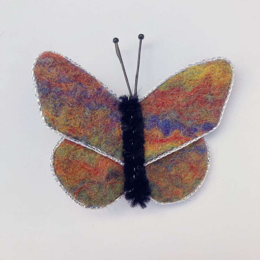 Multicoloured felt butterfly brooch with silver trim