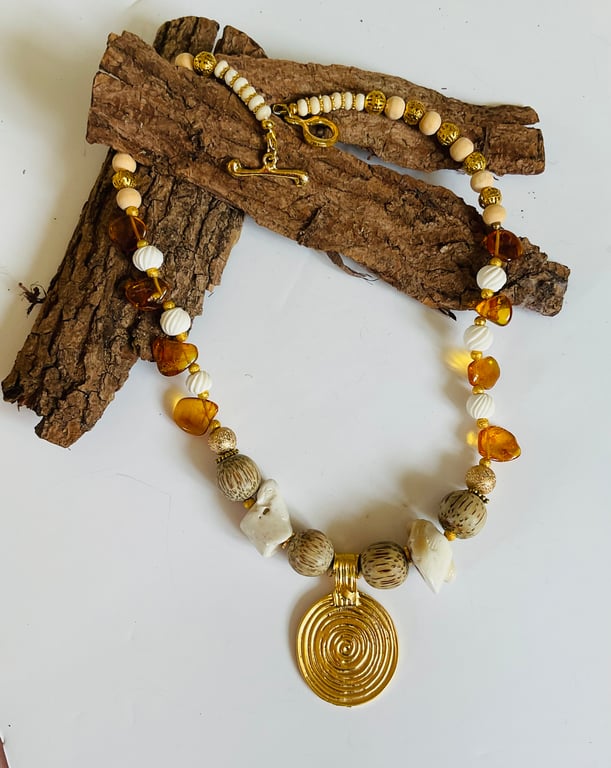 Cream, gold and coral pendant necklace, amber, bone and sandalwood 