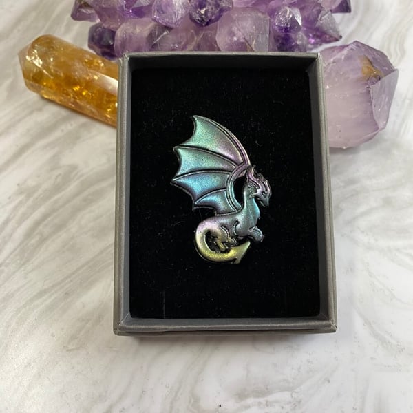 Dragon iridescent shimmer brooch made with polymer clay and resin.