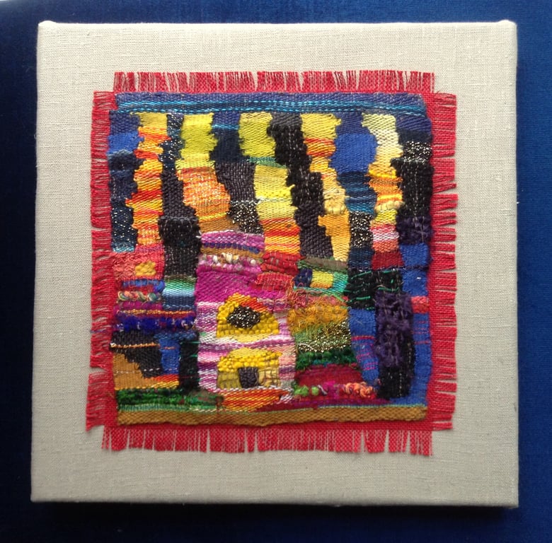 Mounted handwoven colourful tapestry weaving inspired by Hundertwasser