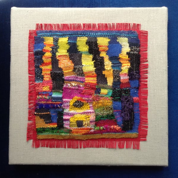 Mounted handwoven colourful tapestry weaving inspired by Hundertwasser