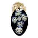 oval pendant - white millefiore beads over dark blue enamel