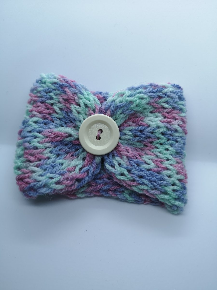 Handknitted pink, purple and mint cup cosie
