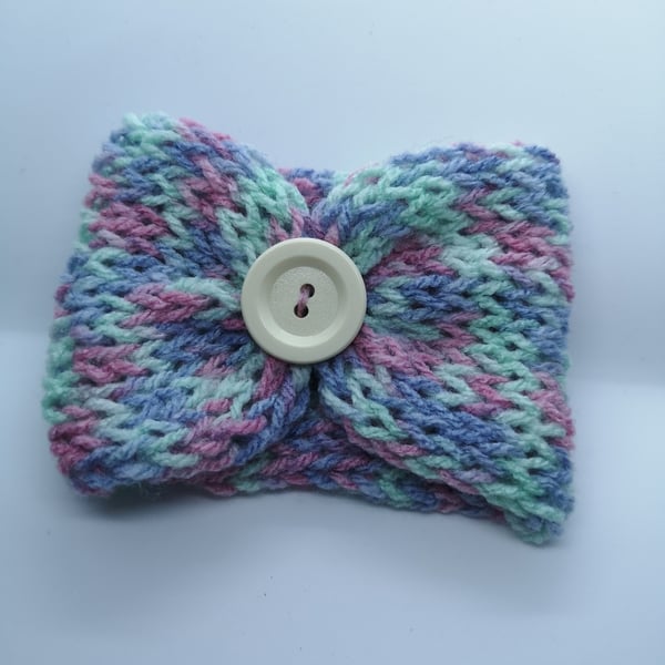 Handknitted pink, purple and mint cup cosie