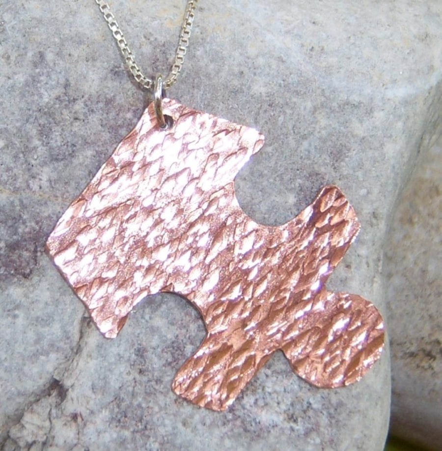 Jigsaw pendant in copper