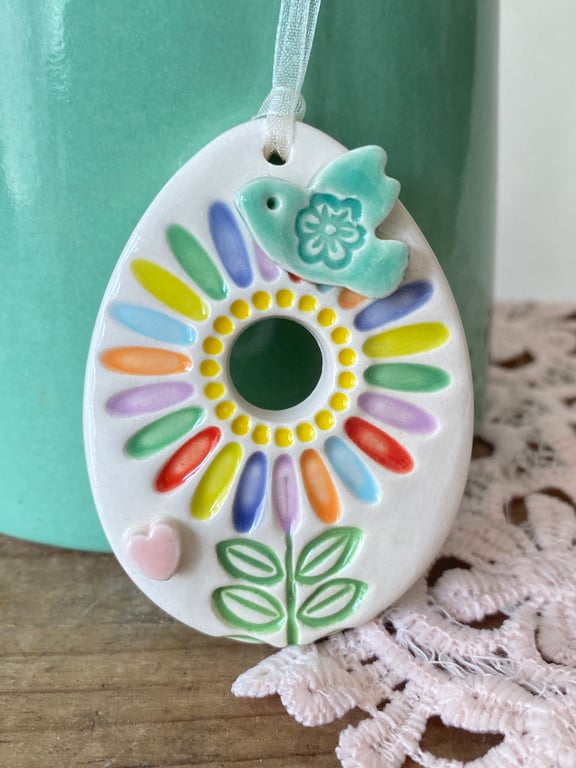 Pottery Easter Egg decoration with bright flower and bird