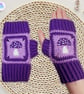 Crochet gloves in a purple lilac and white toadstool design. Toadstool gloves.