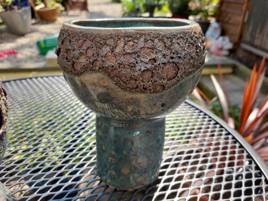 Handmade stoneware pot with green & textured lava look glaze