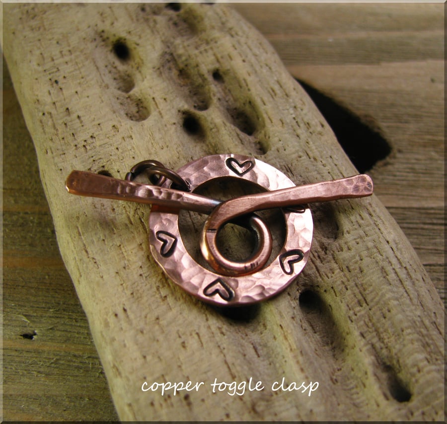 Copper washer toggle clasp
