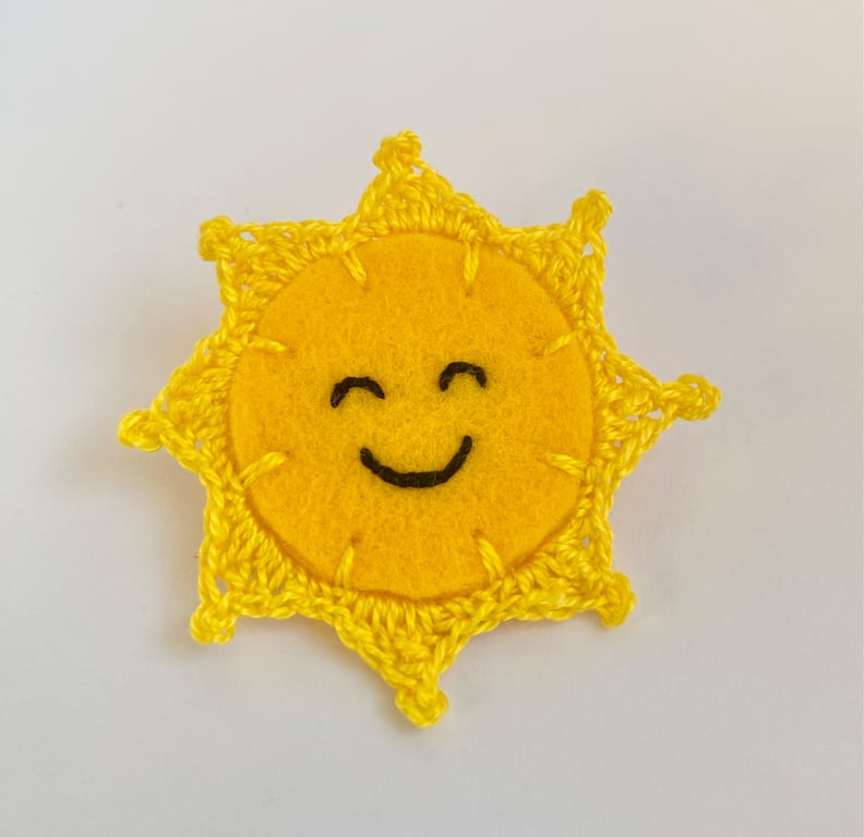Sun brooch smiling embroidery with micro crochet sun rays