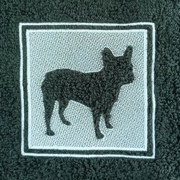 French Bulldog embossed on a black towel using light grey embroidery thread