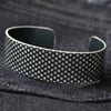 Geometric spotty pattern cuff bracelet black