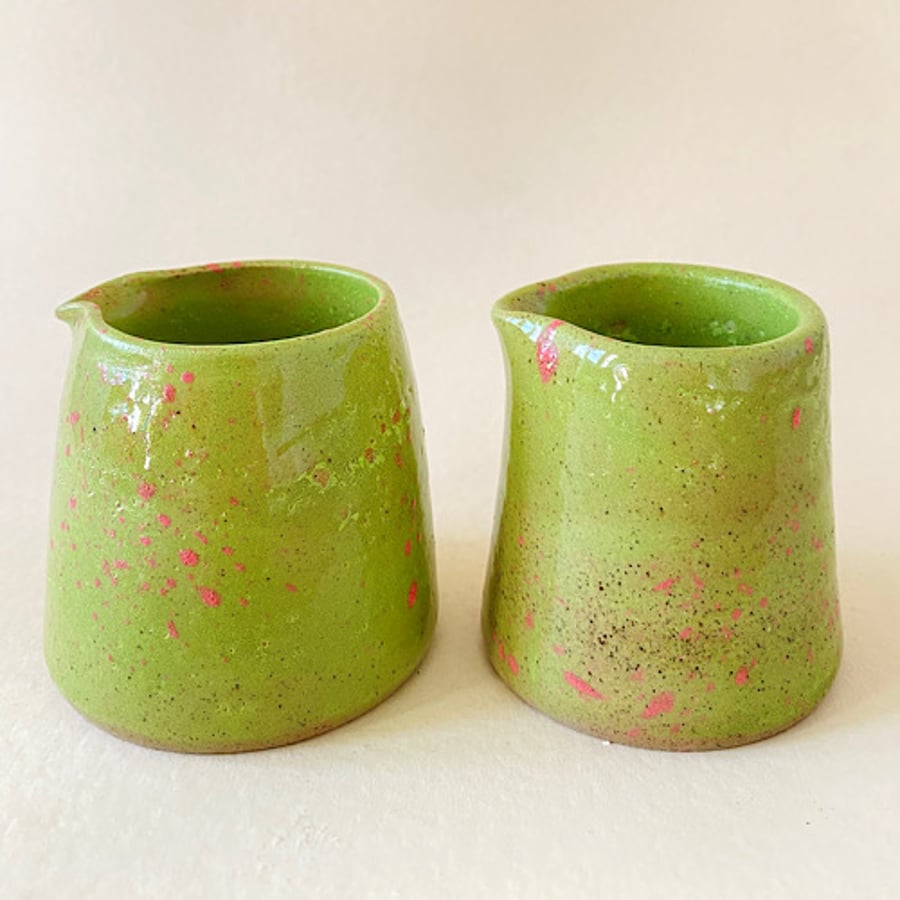 Lime green and pink splat pourer pair.