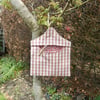 Peg bag in pink check with floral lining