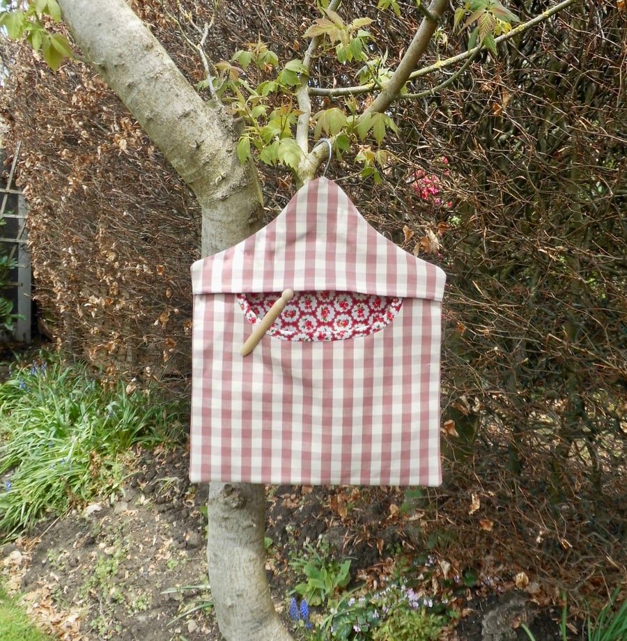 Peg bag in pink check with floral lining